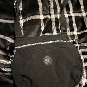 Kipling crossbody bag has some markings on back, great condition on inside